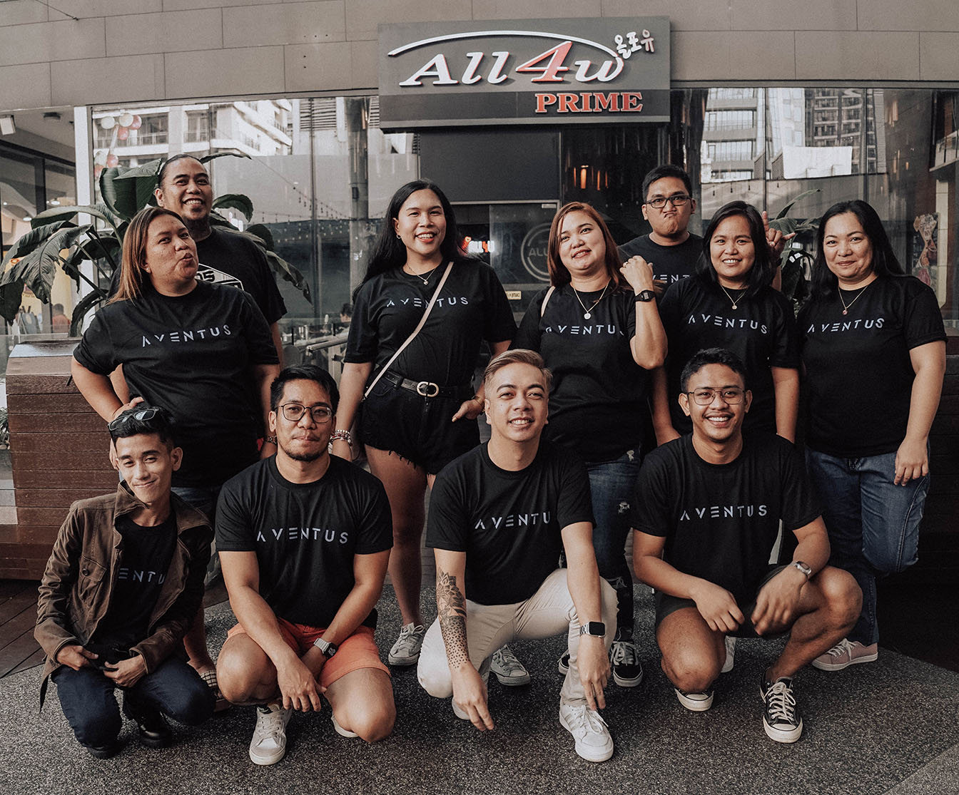 Some members from the Aventus Philippines team posing in front of a restaurant