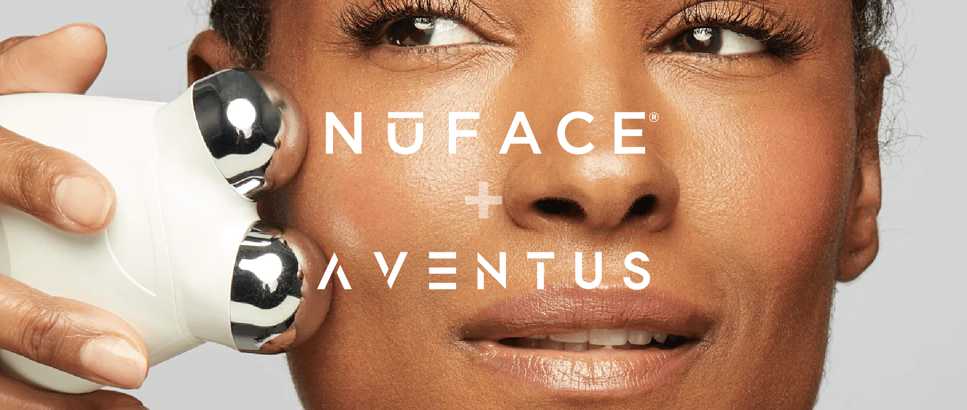 A beautiful woman with great skin operates one of NuFACE's microcurrent devices.